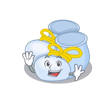 Çekici bir erkek bebek botu maskot tasarımı gülümseme ve el sallama