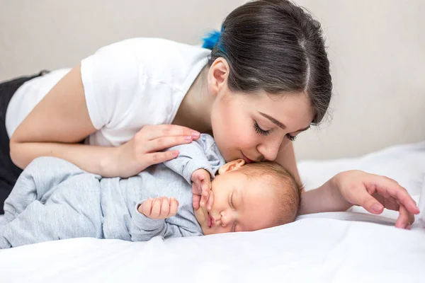 Young Happy Mother Kissing Her Newborn Son — Stock Photo, Image