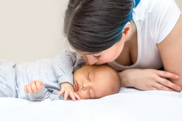 Young Happy Mother Kissing Her Newborn Son — Stock Photo, Image