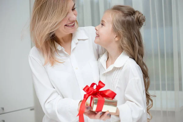 Daughter Giving Her Mother Christmas Present Home Living Room Stock Image