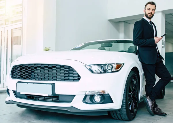 Handsome Man Black Suit Holding Smartphone Standing New Modern Car — Stock Photo, Image