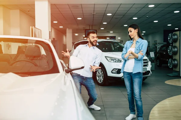 Happy Man Showing New Car His Woman Dealership — Stock Photo, Image