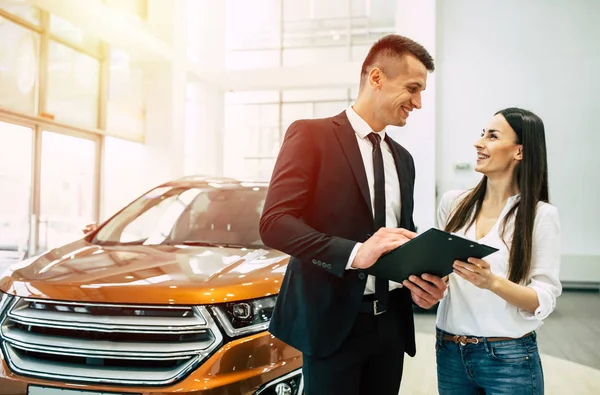 Woman Buying New Car Dealership Talking Male Consultant Documents — Stock Photo, Image