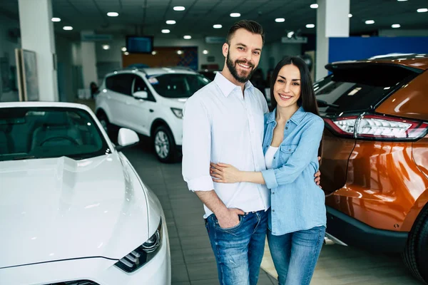 Happy Couple Hugging Standing Car Background Dealership — Stock Photo, Image