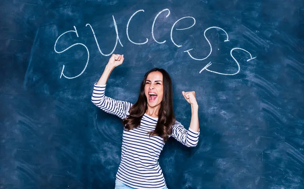 Beautiful woman with drawn word success — Stock Photo, Image