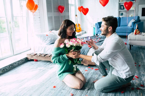 Young man and woman being engaged