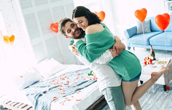 Young Man Holding Woman Arms Bedroom — Stock Photo, Image