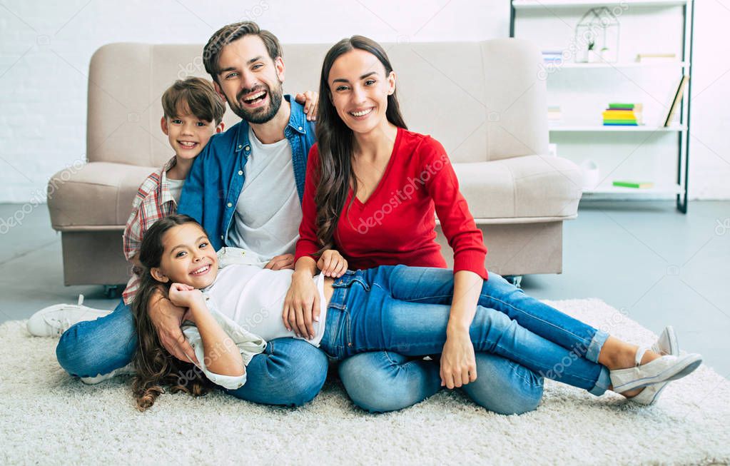 Young family spending happy time at home 