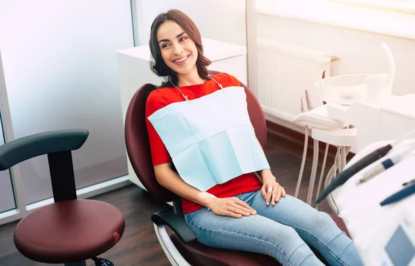 Appointment Dentist Sincerely Smiling Girl Wearing Red Sweater Blue Jeans — Stock Photo, Image