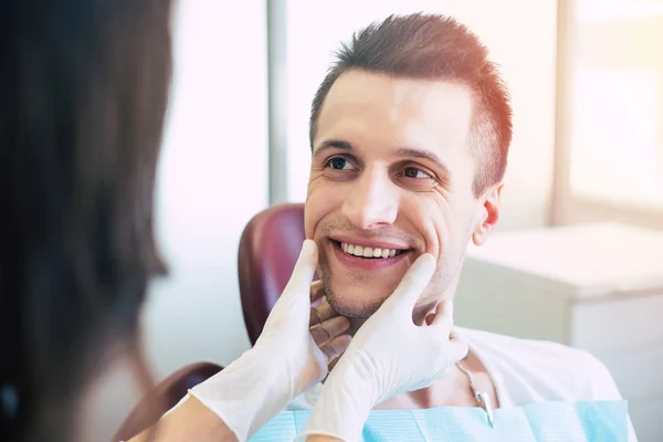 Dazzling Smile Man Dental Chair Front Doctor Who Overlooking Her — Stock Photo, Image