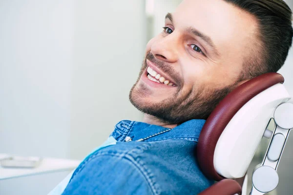 Patient Dental Clinic Sitting Dental Chair Wearing Denim Shirt Smiling — Stock Photo, Image