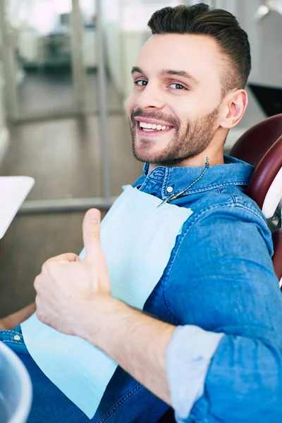 Sincere Man Dental Chair His Thumb Turned Because Perfect Smile — Stock Photo, Image