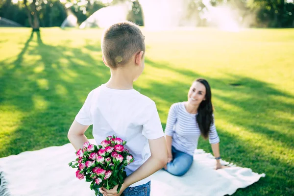 Present Mother Day Little Cute Son Makes Surprise Flowers Hands — Stock Photo, Image