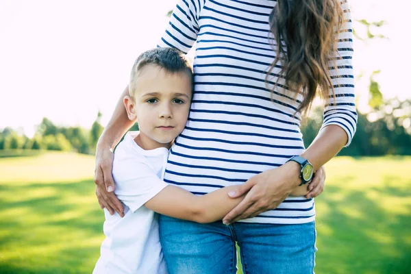 Safe Mom Sad Little Boy Hugging His Young Mother Looks — Stock Photo, Image