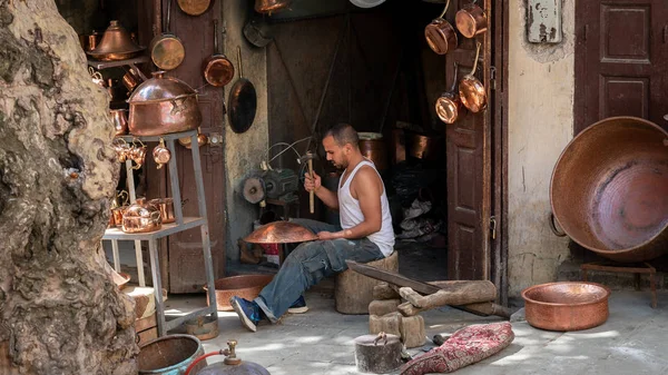 Fez, Morocco - April 2018: Craftsmen in the Medina o Fez city working traditional handycrafts, Morocco