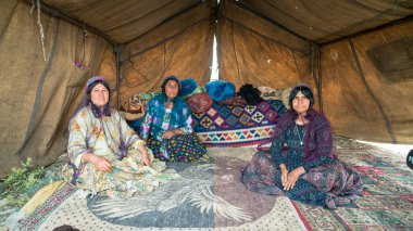 Qashqai nomadic women inside their tents, Iran clipart