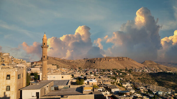 Mardin, Turkey - January 2020: Mardin old city cityscape with Sehidiye mosque minaret