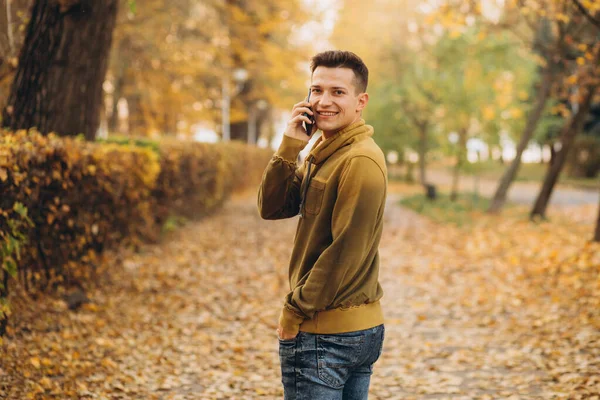 Portrait Handsome Happy Guy Smiling Talking Phone Autumn Park — Stock Photo, Image