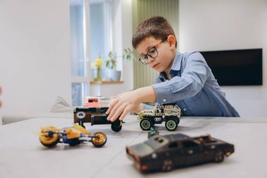 Child enjoying playtime with construction toys, developing creativity and imagination in a domestic setting