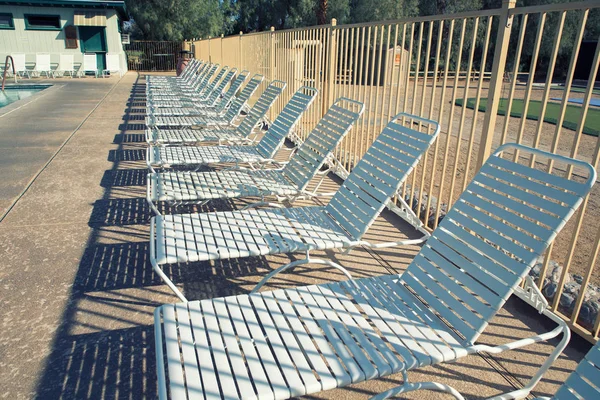 deck chairs and swimming pool with filter effect