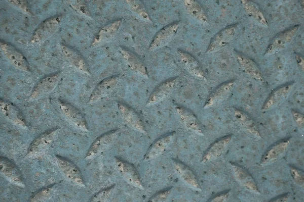 Old rusty green diamond metal plate texture pattern used as abstract background