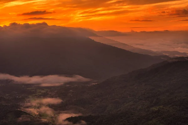mountains under mist in the morning with beautiful sky in Phu Phaya Pho, Phrae Province, Thailand