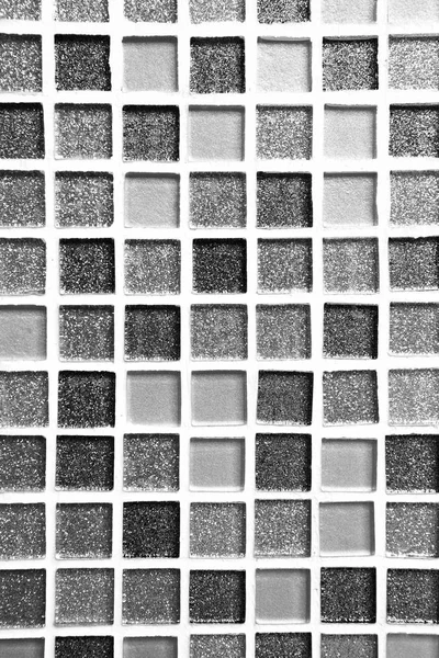 abstract grey square pixel mosaic wall background and texture