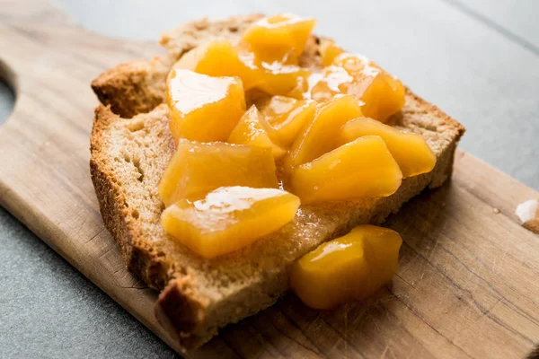 Peach Marmalade Jam with Bread with Fruit Pieces. Organic Homemade Food.