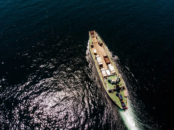 Aerial Drone View of Cargo Ship Carry Vehicles to the Island. Transportation