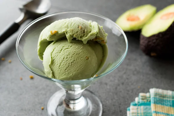 Avocado Ice Cream in Glass Cup with Hazelnut Powder. Organic Summer Dessert.