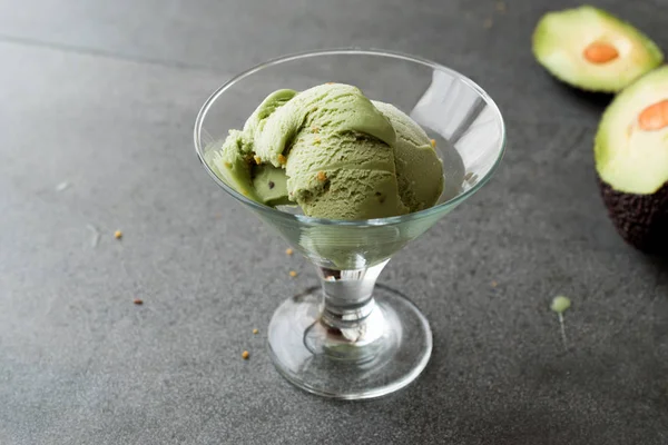 Avocado Ice Cream in Glass Cup with Hazelnut Powder. Organic Summer Dessert.