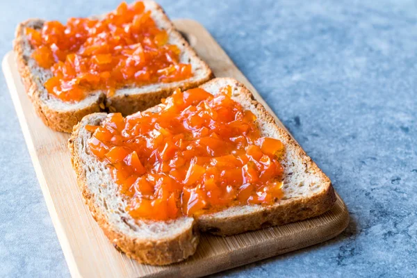 Carrot and Rose Jam on Bread / Mixed Marmalade. Organic Food for Breakfast.