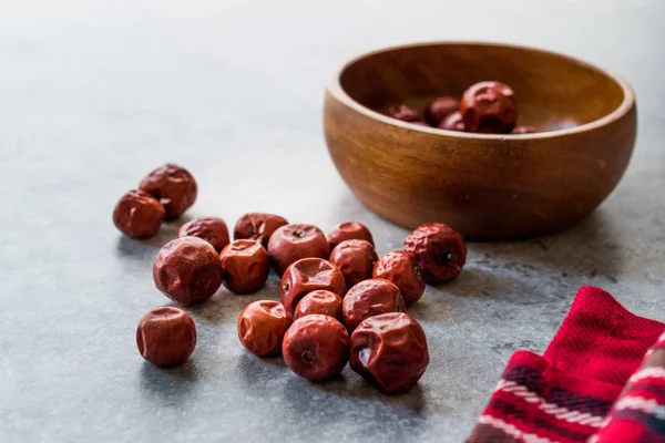Red Jujube Fruits in Wooden Bowl / Hunnap / Organic Food.
