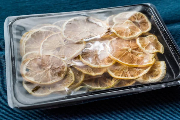 Package of Dried Lemon Slices / Dry and Sliced in Plastic Box / Container. Organic Food.