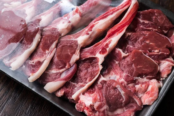 Package of Raw Lamb Chops Meat in Plastic Box / Container. Organic Product.