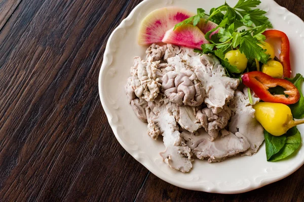 Turkish Offal Food Lamb Brain with Salad / Beyin Sogus served with Plate. Traditional Organic Food.