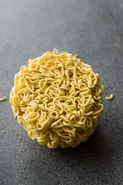 Raw Instant Noodles on Grey Surface. Organic Traditional Food.