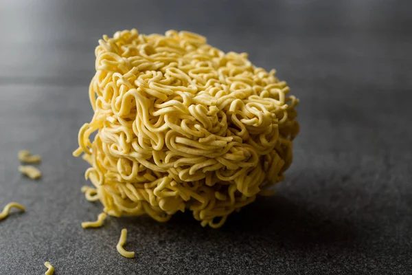 Raw Instant Noodles on Grey Surface. Organic Traditional Food.