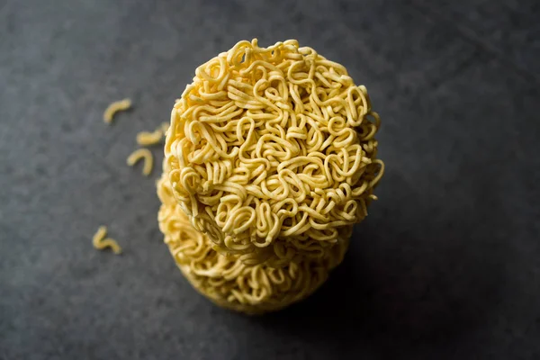 Raw Instant Noodles on Grey Surface. Organic Traditional Food.