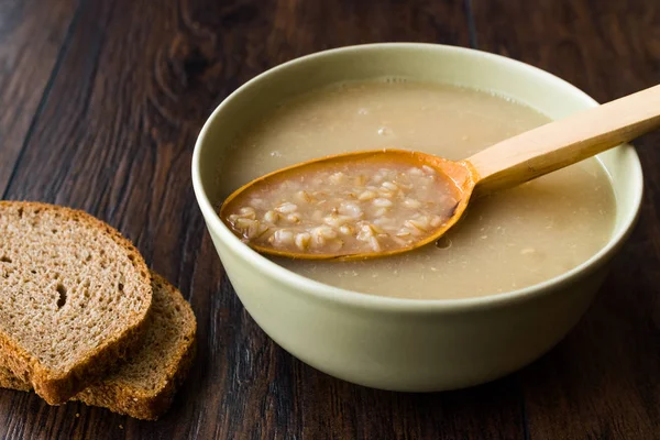 Wheat Soup with Chicken Broth Bouillon on Dark Wooden Surface. Organic Food. — Stock Image Wheat Soup Chicken Broth Bouillon Dark Wooden Surface Organic Food Stock Image