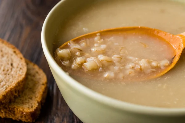 Wheat Soup with Chicken Broth Bouillon on Dark Wooden Surface. Organic Food. — Stock Image Wheat Soup Chicken Broth Bouillon Dark Wooden Surface Organic Food Stock Picture