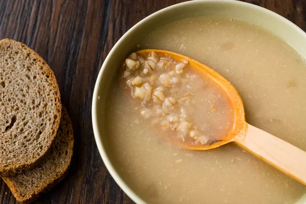 Wheat Soup with Chicken Broth Bouillon on Dark Wooden Surface. Organic Food. — Stock Image Wheat Soup Chicken Broth Bouillon Dark Wooden Surface Organic Food Stock Photo