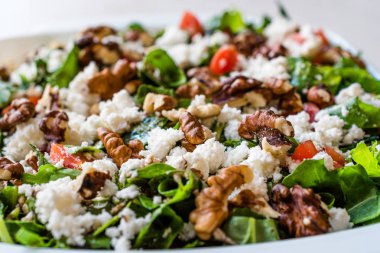 Curd Cheese Salad with Walnut, Arugula Rucola or Rocket Leaves /