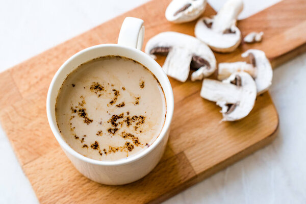 Mushroom Latte Coffee with Milk and Espresso on Wooden Board Rea
