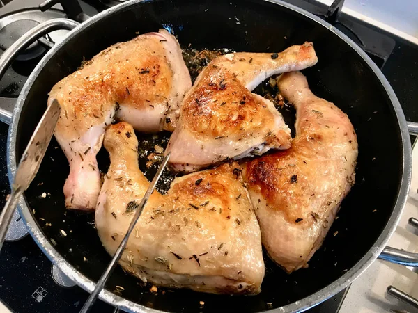 Chicken Legs are Frying in Pan.