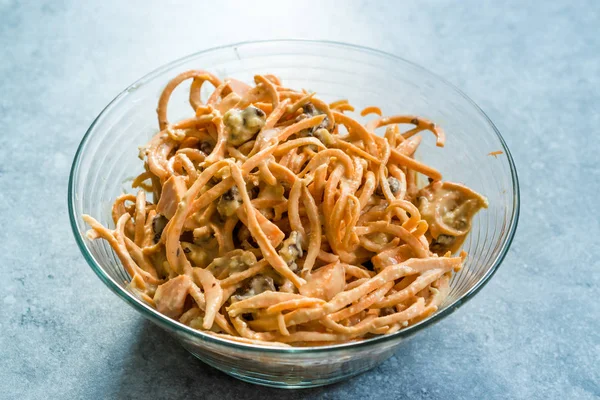 Spiralized Raw Sweet Potato Salad with Tahini / Tahin Sauce, Walnut and Cheese in Glass Bowl. — Stock Photo, Image