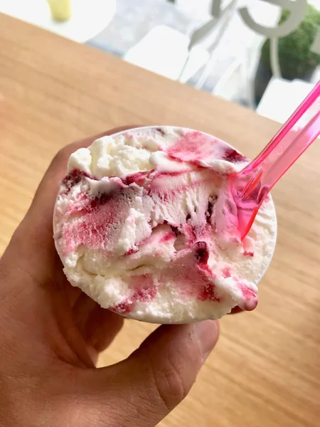 Frozen Yogurt Ice Cream Vanilla and Blackberry Sauce in Plastic Cup