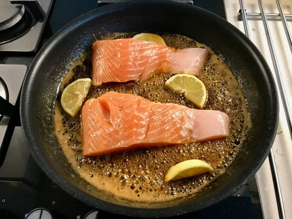 Honey Glazed Salmon Frying in Pan with Burnt Butter and Lemon. — Stock Photo, Image