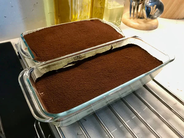 Homemade Whole Tiramisu Cake with Cocoa and Coffee Powder in Glass Bowl. — Stock Photo, Image