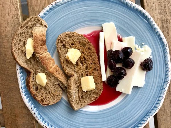 String Cheese with Toast Bread, Butter and Cherry Jam / Marmalad